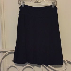 Black fold over knee length skirt